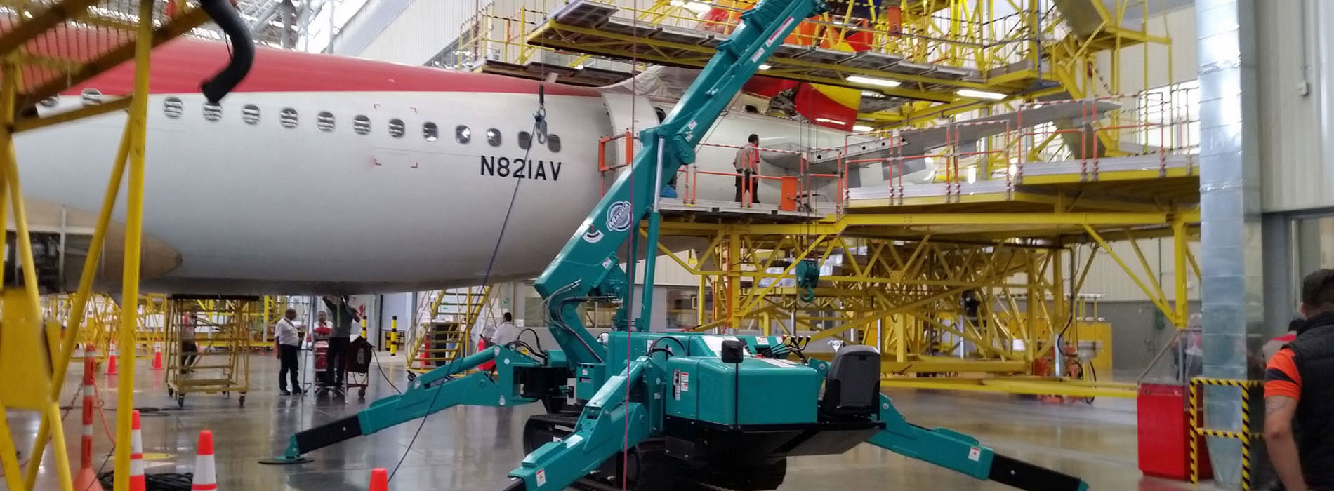 MAEDA Mini Crane work on airplane inside maintenance facilities