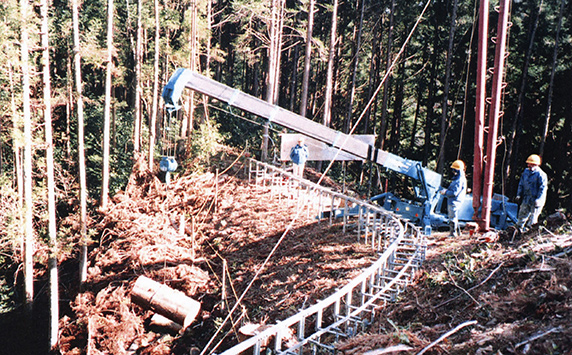 MAEDA Mini Crane lifting cut lumbers for forestry project